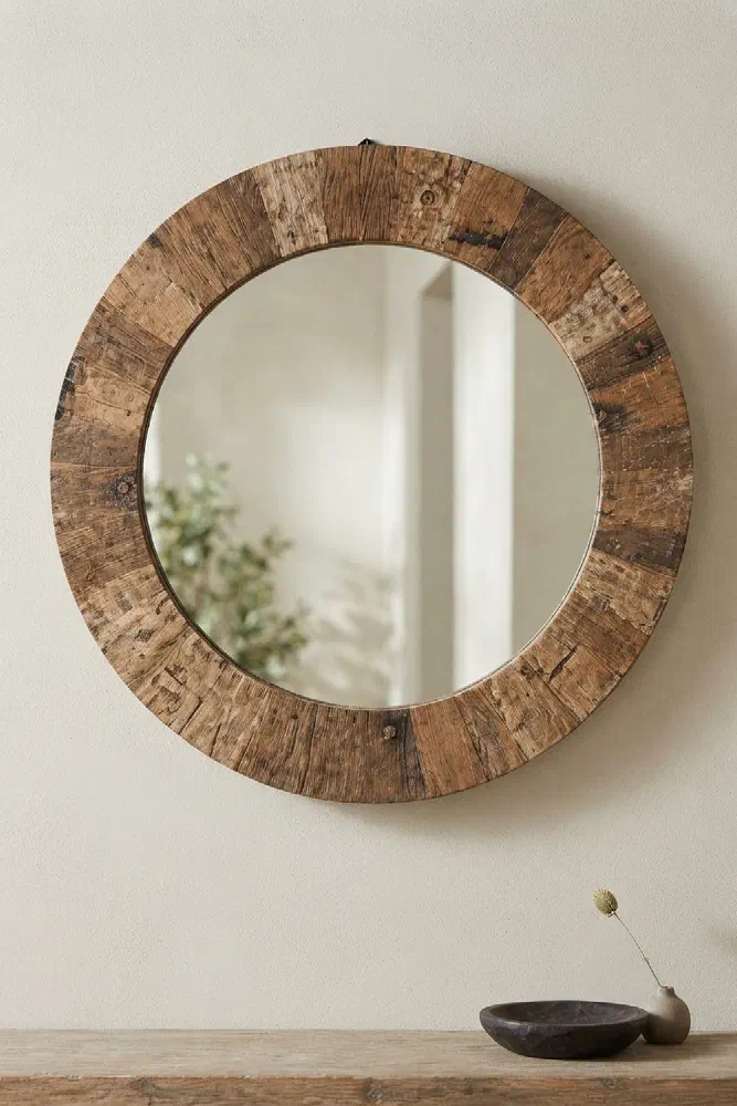Widen a narrow entry with a slim reclaimed round mirror